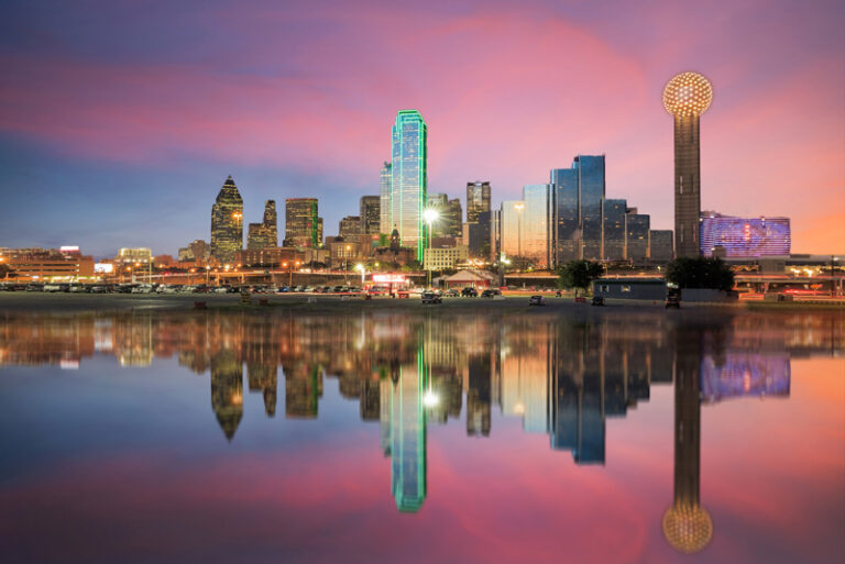 Dallas skyline reflected over the water at dusk